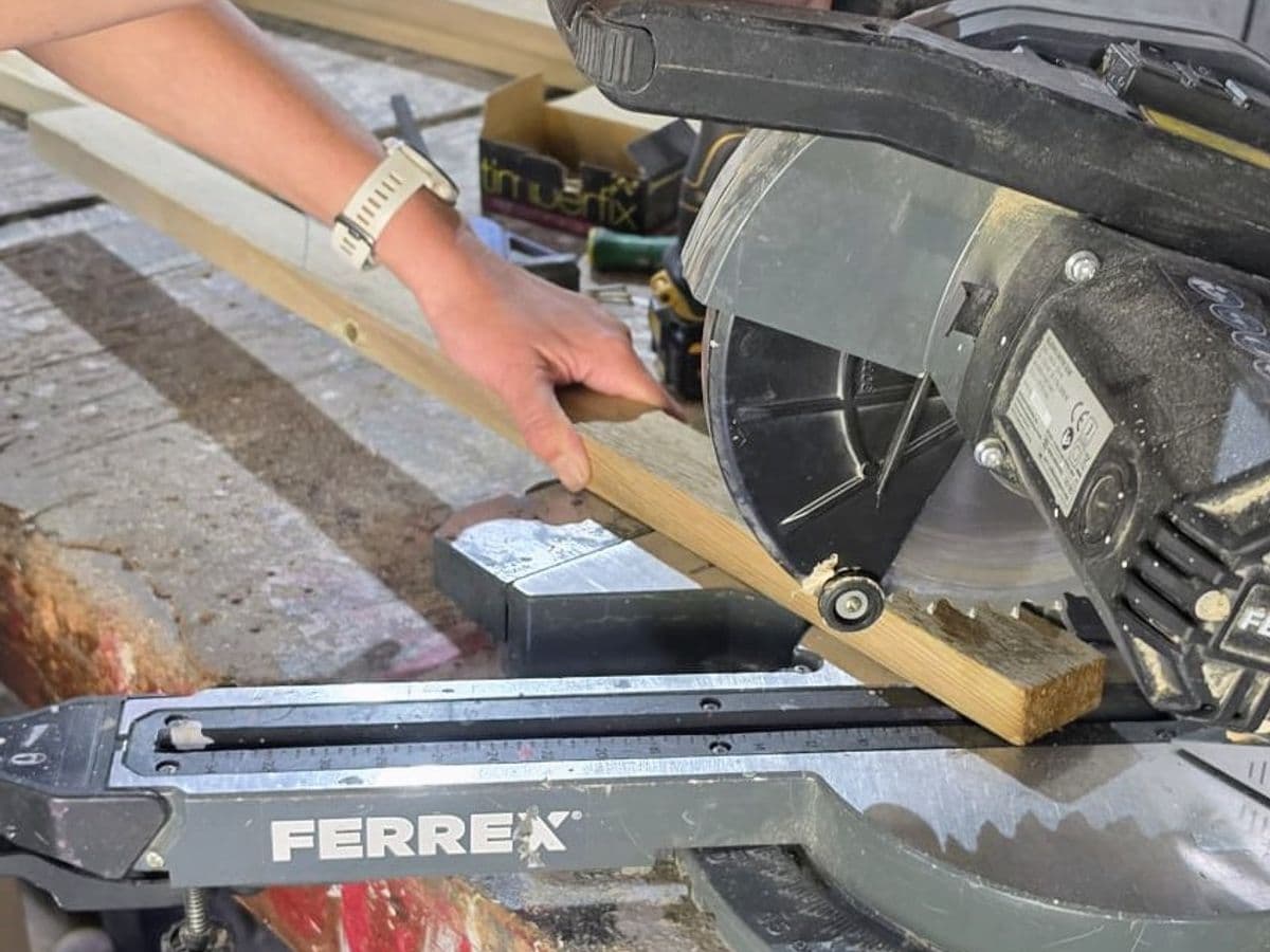 Trimming a length of timber on the mitre saw